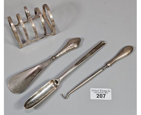 Early 20th century silver four section toast rack. Sheffield hallmarks. 1.89 troy oz approx. Together with silver handled but