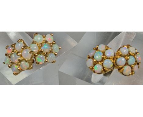 Two similar pairs of opal cluster earrings, one marked 9ct gold the other RG. (B.P. 21% + VAT)