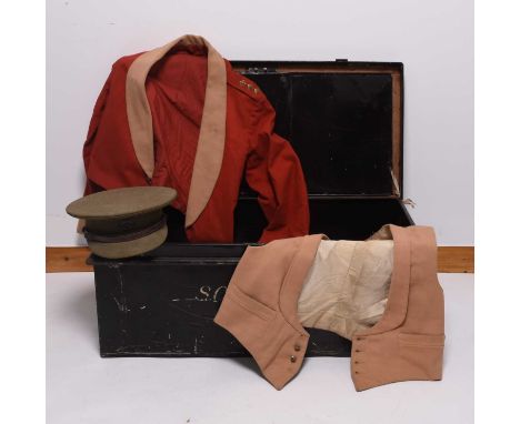 An inter-war group of Wiltshire Regiment uniform in a tin trunk; owned by Captain S.C.R.L Clarke comprising dress uniform tun