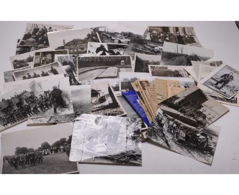 PRESS PHOTOGRAPHS AND CLIPPINGS - First World War. Approximately 60 black and white photographs, 1930s-80s re-prints, with a 