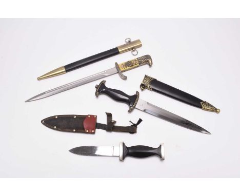 A small group of edged weapons comprising a post-war copy of a German Third Reich police bayonet, with police eagle emblem in