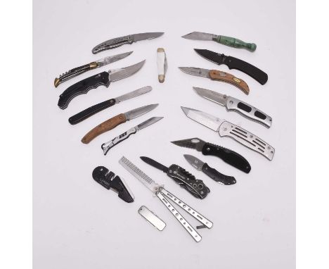 A group of assorted folding knives and pocket/utility knives, including Grand Harvest, Ganzo, French Laguiole, a French made 