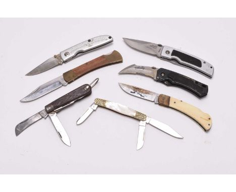 A group of folding knives and multi-tools, comprising an H.Boker &amp; Sons number 153 folding multi-blade pocket knife, with