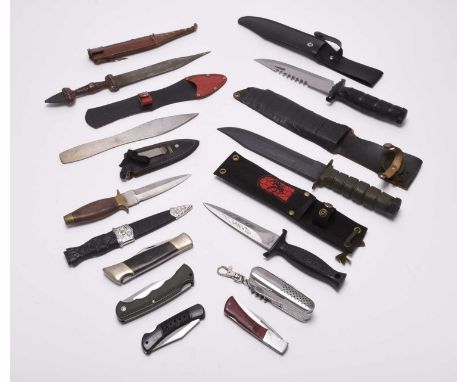 A group of contemporary and vintage knives, comprising a Taiwan UC210 Commando-style knife with 'Black Widow' markings to the