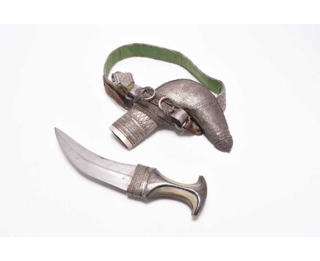 An Omani 'silver' ceremonial khanjar dagger in scabbard with a belt, first or second quarter of the 20th century, the scabbar