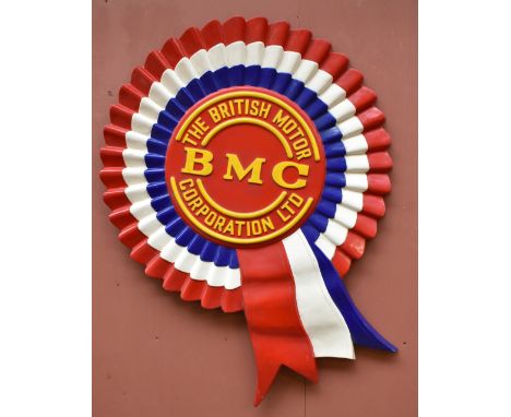 THE BRITISH MOTOR CORPORATION LTD; a vintage advertising fibreglass rosette with embossed text, height 122cm, width 91cm.Prov