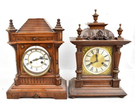 Two early 20th century bracket clocks to include a walnut example, the circular enamelled dial set with Roman numerals, heigh