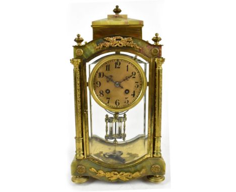 SAMUEL MARTI; a late 19th century French eight day brass and onyx mantle clock, the circular dial set with Arabic numerals, f