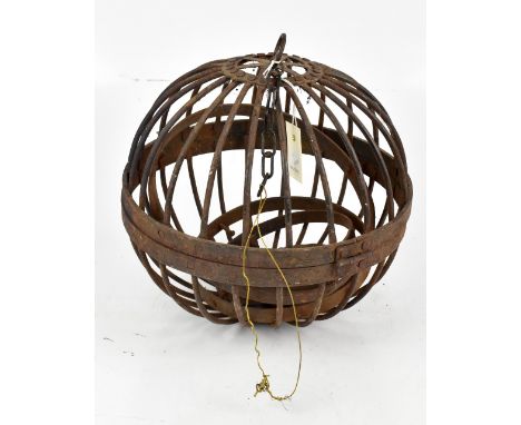 An Indian iron rolling light, height 30cm.Additional InformationRusting and extensive pitting throughout.