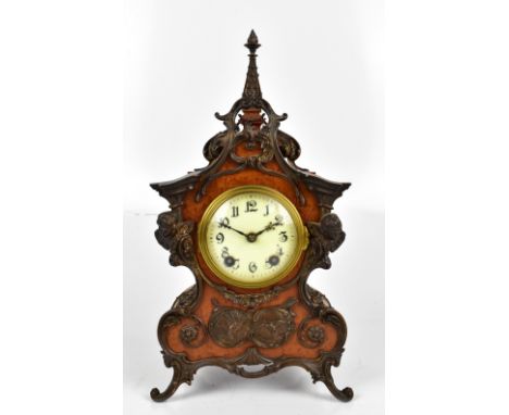 LENZKIRCH; a burr walnut veneered Art Nouveau mantel clock with applied gilt metal detail of birds, mask heads and scrolling 