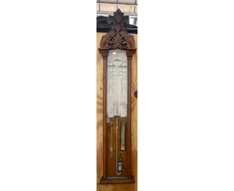 An oak cased Admiral Fitzroy barometer with carved detail to upper section, height 124cm, width 27cm.Additional InformationFa