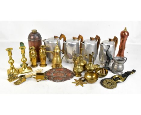 A mixed group of metalware including Piquot coffee pots, copper pepper grinder, brass candlesticks, etc.