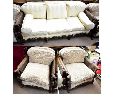 An early to mid 20th century three piece bergere suite comprising sofa and two armchairs with double cane-work panels and lat