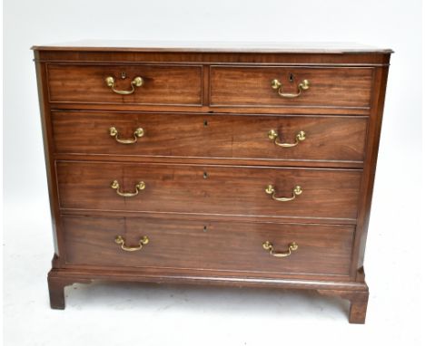 An early 19th century mahogany straight front chest of two short over three long drawers, raised on bracket supports, height 