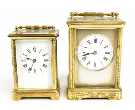 A circa 1900 French brass carriage clock with circular white enamel dial set with Roman numerals, the back plate No.65, heigh