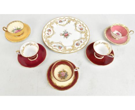 J A BAILEY FOR AYNSLEY; a hand painted pedestal teacup and saucer painted with roses, together with further Aynsley to includ