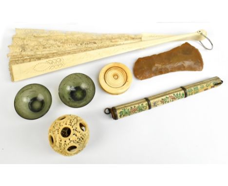 A late 19th/early 20th century Chinese ivory puzzle ball, European carved ivory fan, circular ivory patch box together with a