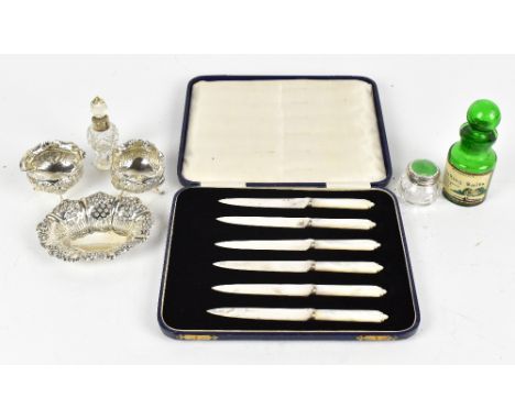 EDWARD SAMUEL JONES: a pair of Victorian hallmarked silver open salts, each with cast floral detail raised on three hoof feet