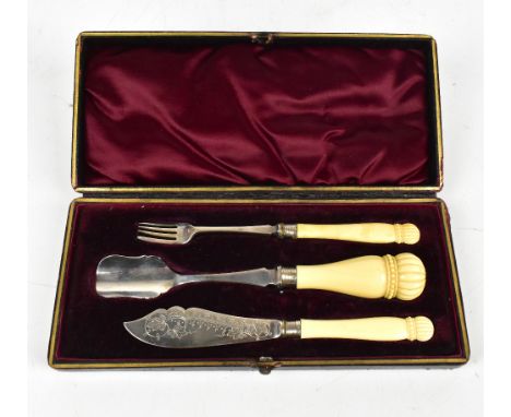 An early 19th century cased flatware service comprising pickle fork, cheese scoop and fish knife with carved ivory handles, h