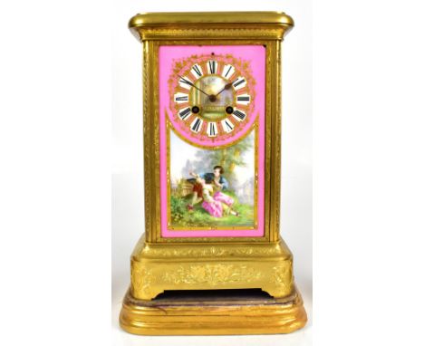 A good 19th century French gilt metal porcelain mantel clock, the central painted panel depicting figures in landscape settin