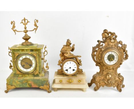 A late 19th century French gilt spelter mantel clock, the circular dial set with Roman numerals below a seated figure playing