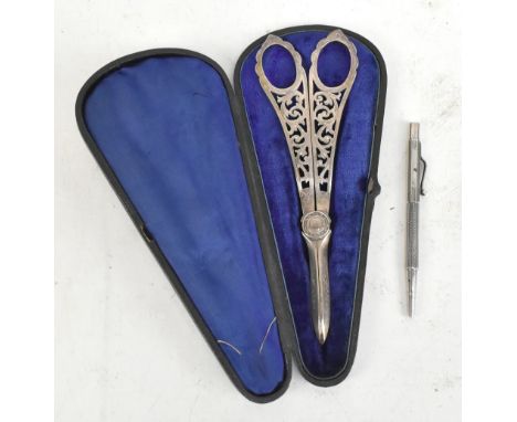 A cased set of silver plated grape scissors with pierced floral detail to the handle, length 18cm, together with a hallmarked