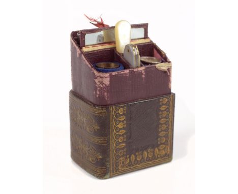A late 19th century lady's novelty sewing set, the outer case in the form of a book inscribed 'Lady's Companion', the cover e