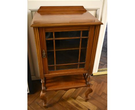 An Edwardian mahogany music cabinet, the glazed door enclosing three shelves above undertier on cabriole legs, 90 x 47 x 36cm