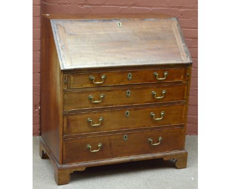 A 19th century oak bureau, the fall front enclosing fitted interior above four drawers, raised on bracket feet, height 102cm,