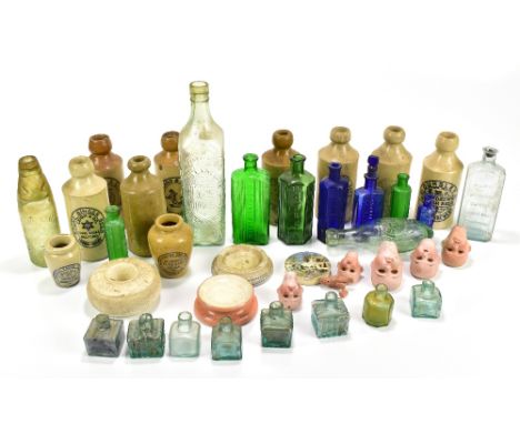 A group of vintage advertising with ginger beer bottles including Leigh &amp; Co examples, further bottles, Manchester Creame