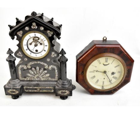 A Victorian ebonised mantel clock with mother of pearl inlaid decoration surrounding a circular enamelled dial set with Roman