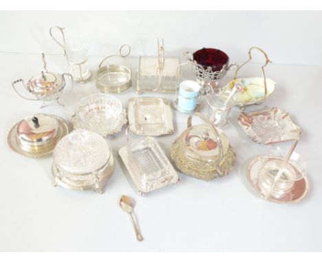A group of silver plated and mounted butter dishes, sugar bowls and condiment sets including examples with clear glass liners
