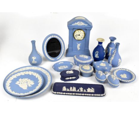 WEDGWOOD; a collection of assorted blue jasperware to include mantel clock, height 22.5cm, bud vases, rectangular trays, also