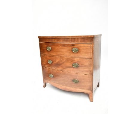 An early 19th century inlaid mahogany bowfront&nbsp;chest of three drawers, raised on bracket feet, height 90.5cm, width 89cm