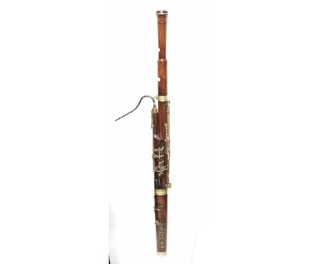 BUFFET CRAMPON AND CO PARIS; an early 20th century rosewood bassoon with nickel plated mounts, length 128cm.Additional Inform