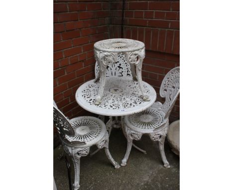 An aluminium garden table, 3 chairs and a stool