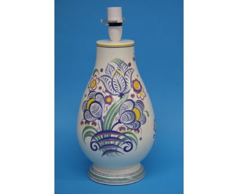 A Poole pottery baluster shaped table lamp decorated with stylised flowers, impressed marks and numbered 670, 32.5cm height