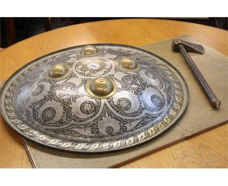 A Saddle Battle axe, the axehead with ornate fighting tigers and a circular shield