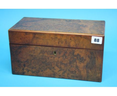 A Victorian walnut tea caddy opening to reveal glass mixing bowl and two caddies, 30cm wide