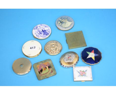 An enamelled rectangular compact and nine various compacts (10)