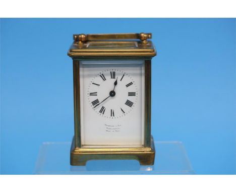A small brass carriage clock with enamelled dial, Harrison and Son Darlington, Made in Paris, 11cm height