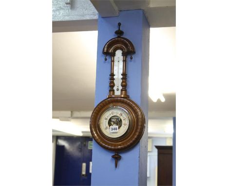 A carved mahogany barometer