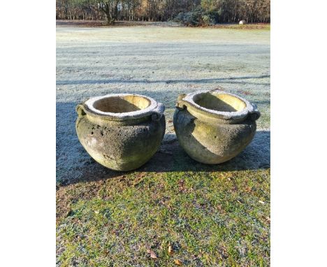 A similar slightly smaller pair of carved Cotswold limestone scroll pots19th century  45cm high by 61cm diameterSee similar l