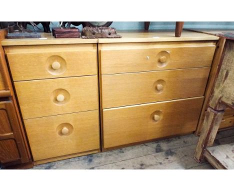 A light oak finished chest of three long drawers with sunken knob handles and a matching three drawer bedside chest 