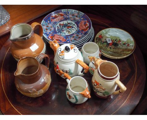 A five piece fox hunting scene tea set, three plates, two stoneware jugs and a set of six Japanese style plates 