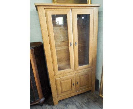 Heavy light oak two door glazed bookcase with cupboards under (no shelves) 3' wide 