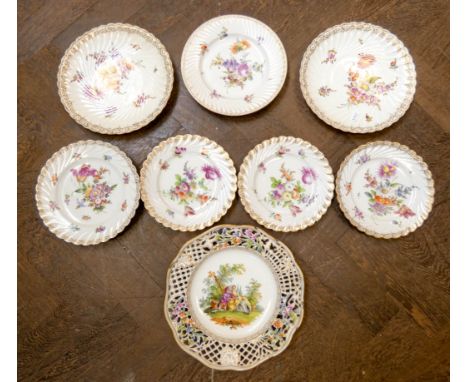 A collection of Dresden floral painted cabinet plates to include one with decorative pierced edge and hand painted pastoral s