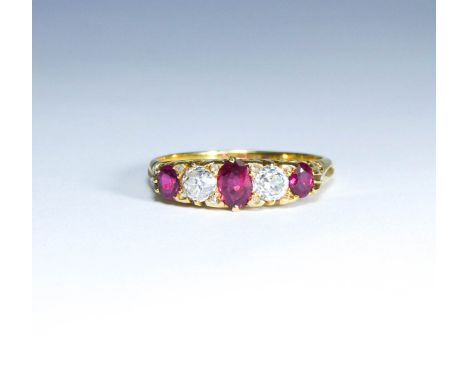 Ruby and diamond five stone half hoop ring, in carved 18ct yellow gold setting. Ring size R