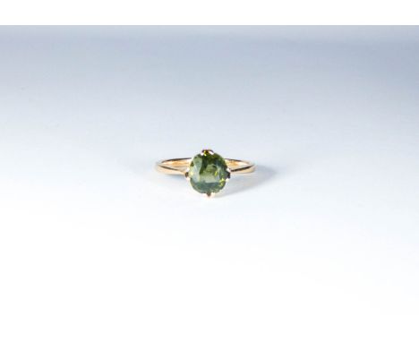 Green tourmaline claw set ladies dress ring, on unmarked gold shank. Ring size R weight 3.8 grams