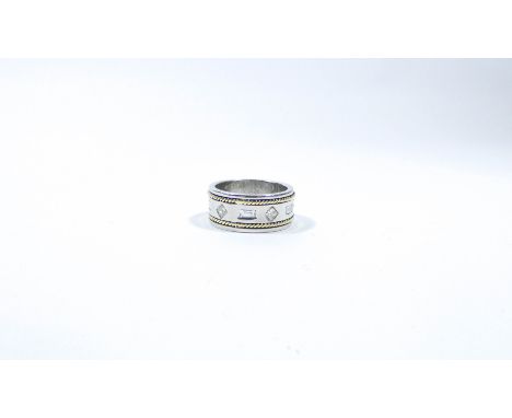 Large modern 18ct bi-colour gold wedding band, set with alternate baguette and princess cut diamonds. Ring size R 14 grams ap